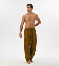 Earthy brown boho pants for men, designed with a harem cut and comfy cotton fabric, perfect for festivals and casual wear.