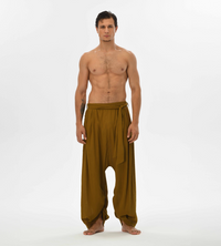 Comfy brown harem trousers for men, featuring a relaxed fit and breathable cotton fabric, ideal for lounging or yoga sessions.