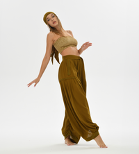 Brown boho harem pants for women, designed with a comfy, loose fit and made from soft cotton, ideal for casual wear or festivals.