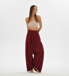 Women’s yoga pants in red, featuring a loose, relaxed fit and comfy cotton fabric, ideal for yogis and boho chic style lovers.