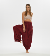 Women’s comfy boho harem pants in red, made from high-quality cotton with a loose fit, perfect for yoga, daily wear, or boho chic outfits.