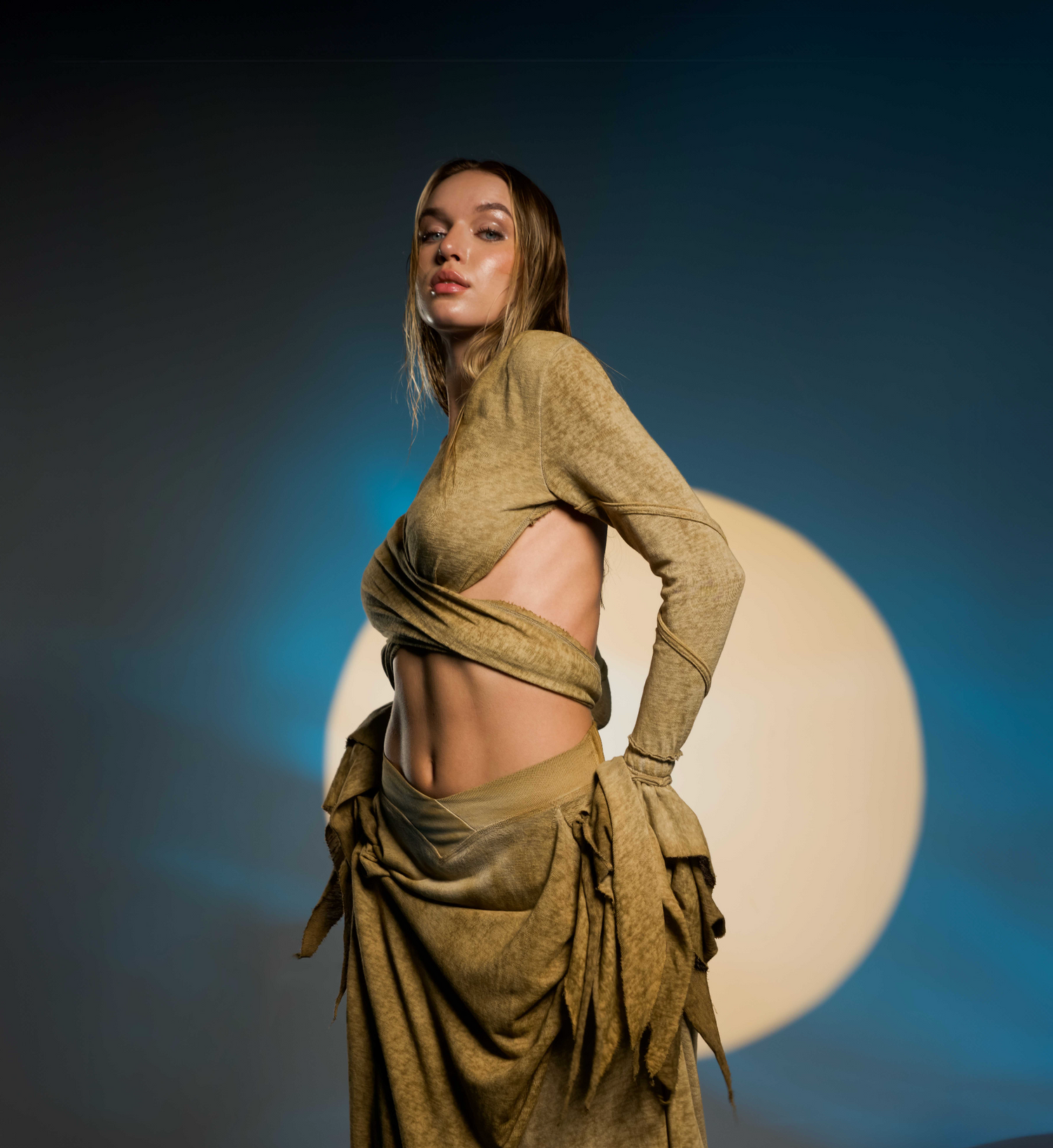 Selene Bolero Top in desert sand, featuring flowy fairy sleeves and an open back design, perfect for boho chic and festival looks.