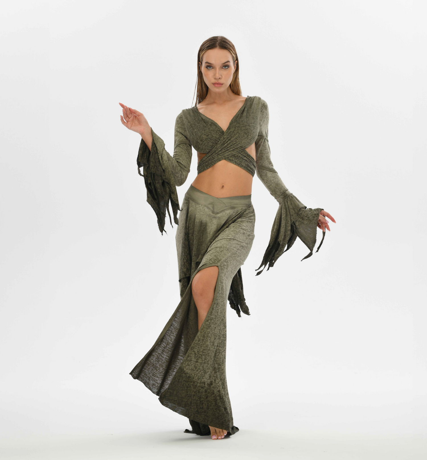 Green boho bolero top with an open back, tie-front design, and flowy fairy sleeves, perfect for casual or festival wear.