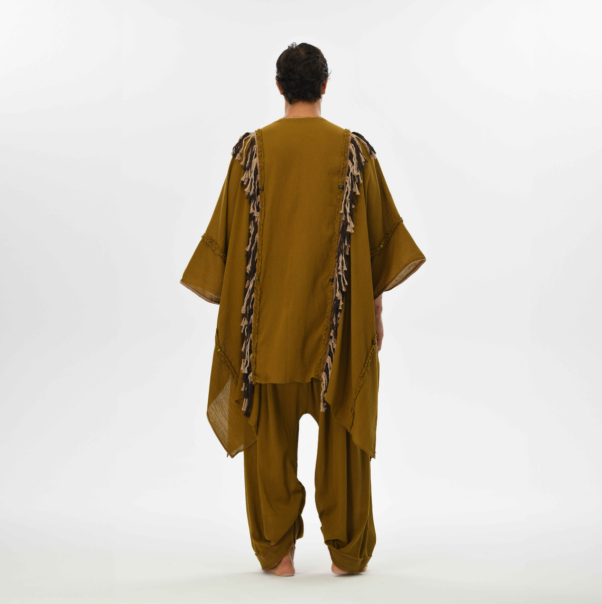 Boho cape for men in brown, crafted from natural cotton with handmade tassels and braids, perfect for festivals or casual wear.