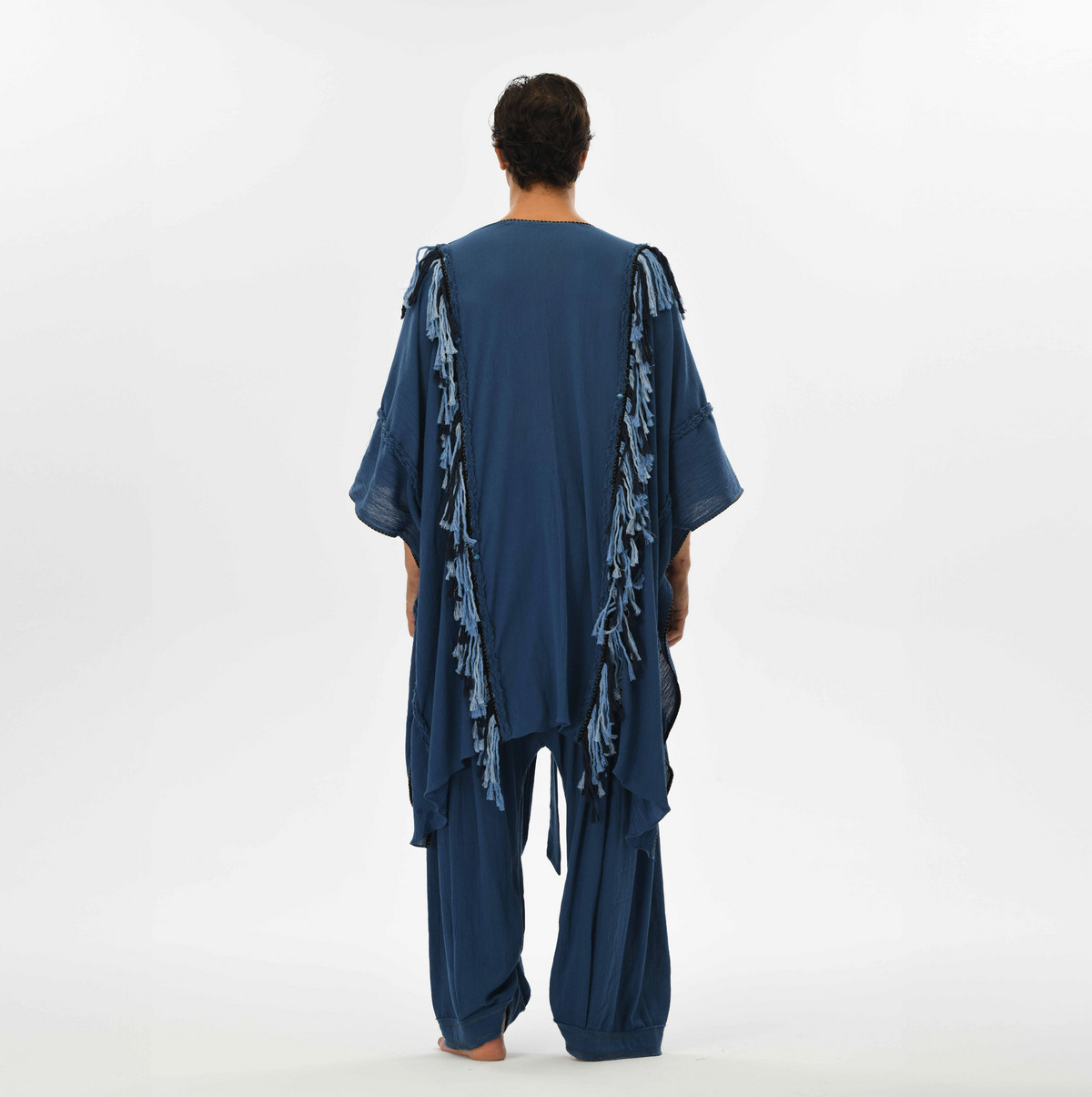 Fringed boho poncho for men, designed with braided details and handmade tassels in navy blue organic cotton, perfect for festivals or casual wear.