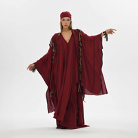 Red boho fringed poncho for women, featuring braided embellishments. Made from organic cotton, perfect for casual and festival boho chic looks.