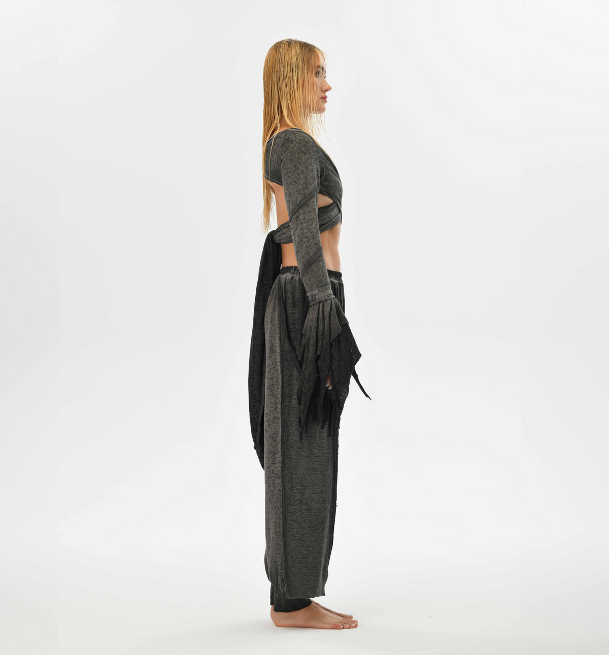 Loose charcoal gray harem pants in a bohemian gypsy style, made from a soft cotton-linen blend with an elastic waistband. Ideal for festivals, casual outings, or lounging. Available in two sizes.