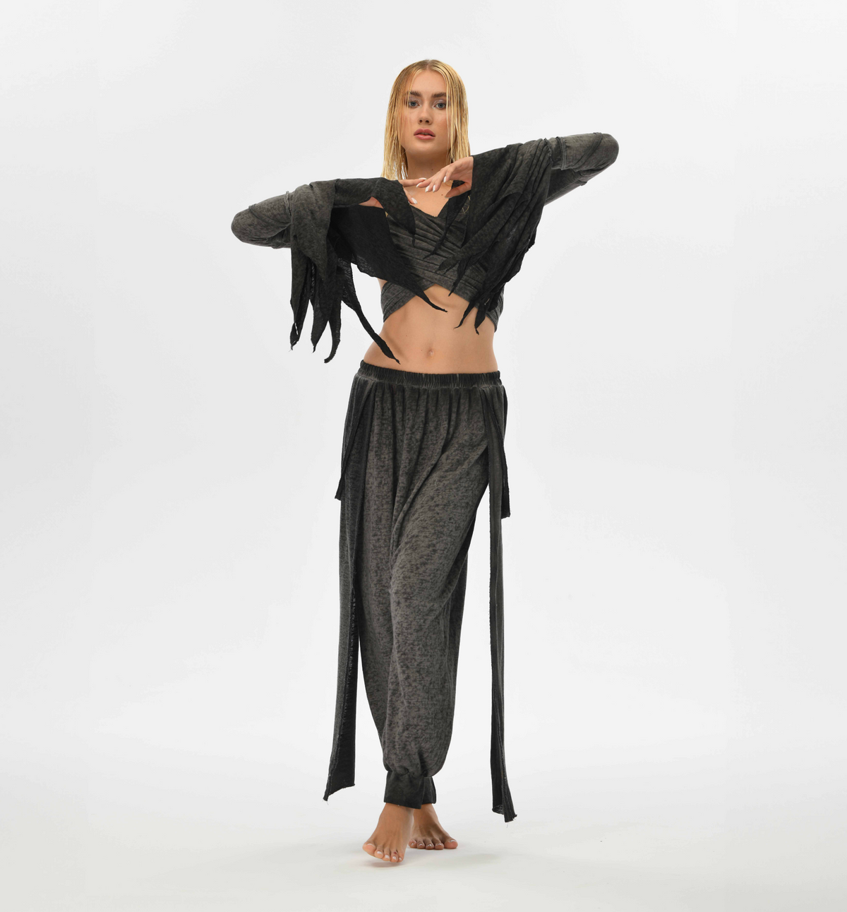 Gypsy style charcoal gray harem pants with a relaxed fit. Crafted from a linen-cotton blend with an elastic waistband, these pants are perfect for festivals, casual boho outfits, or lounging.