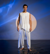 White harem pants for men, made from linen and cotton blend with an elastic waistband, perfect for boho festival wear.