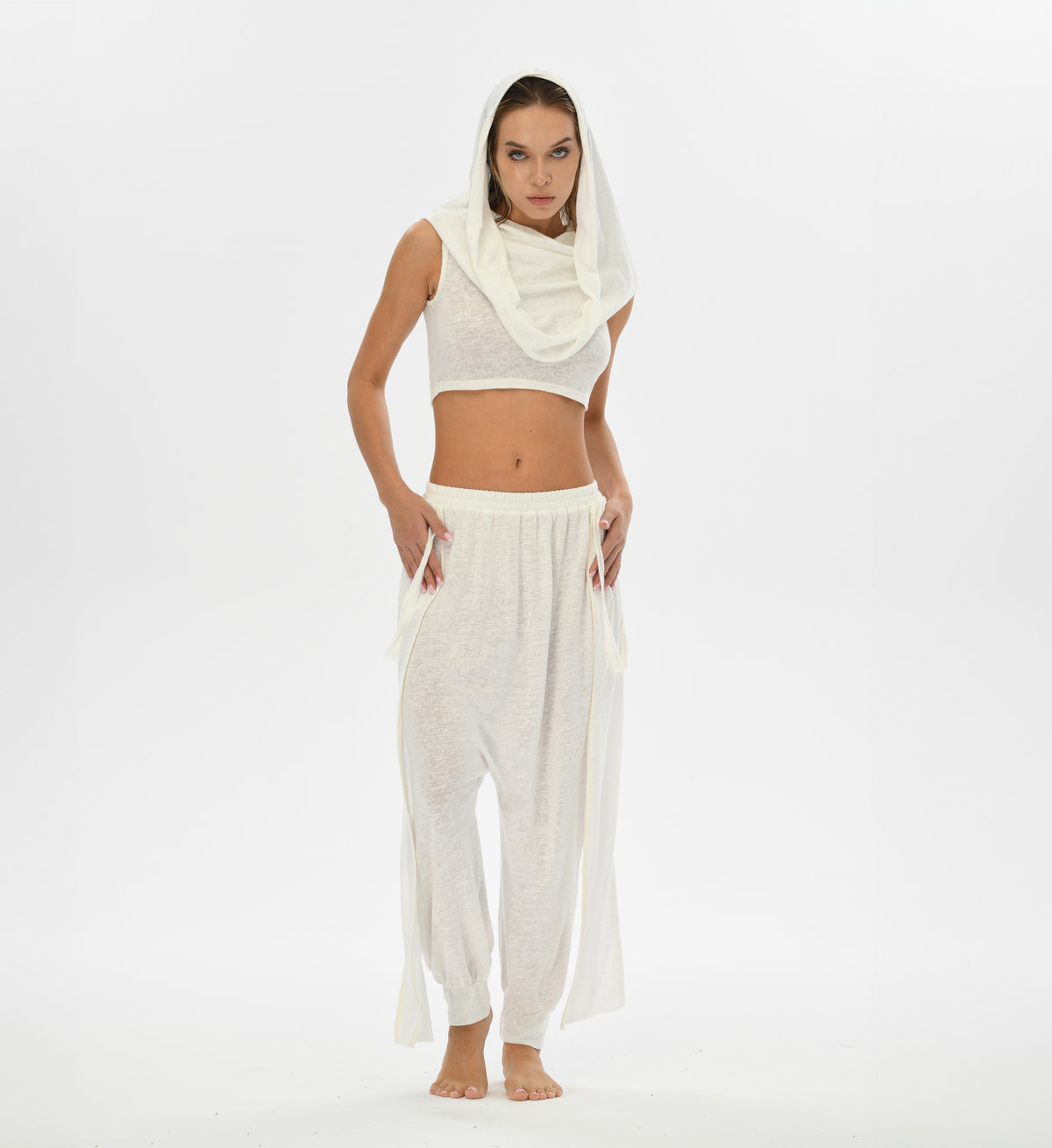 Loose white harem pants with gypsy style, crafted from a soft linen-cotton blend. These pants feature an elastic waistband and are perfect for festivals, boho style, or lounging.