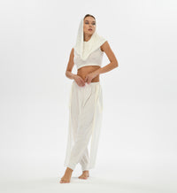 Loose-fitting white harem pants with alchemist and gypsy vibes, made from a linen-cotton blend. Ideal for festivals, casual outings, and boho style. Available in two sizes for a flexible fit.