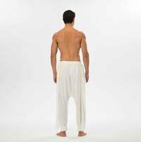 Comfy men’s white harem pants with elastic waistband, perfect for festival style or everyday casual boho looks.