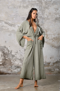 Step into timeless elegance with our Greek Goddess Asymmetrical Jumpsuit. This handmade boho chic jumpsuit offers unique style for beach weddings, festivals, and everyday wear. Embrace the goddess within and make a statement with this one-shoulder, earth-toned design