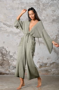 Step into timeless elegance with our Greek Goddess Asymmetrical Jumpsuit. This handmade boho chic jumpsuit offers unique style for beach weddings, festivals, and everyday wear. Embrace the goddess within and make a statement with this one-shoulder, earth-toned design