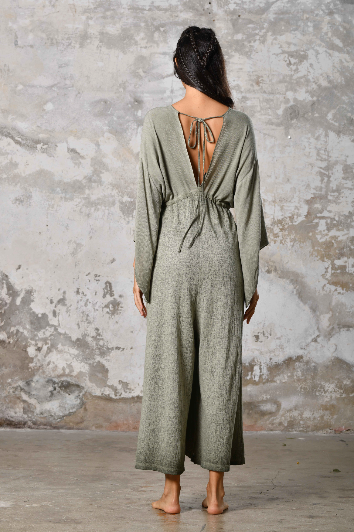 This handmade piece exudes a sense of freedom and flow, perfect for those who appreciate individuality and fashion-forward comfort. Whether you're dancing by the shore or strolling through a summer festival, this jumpsuit will ensure you stand out with grace and style. Embrace the goddess within and make a bold fashion statement with this unique piece.