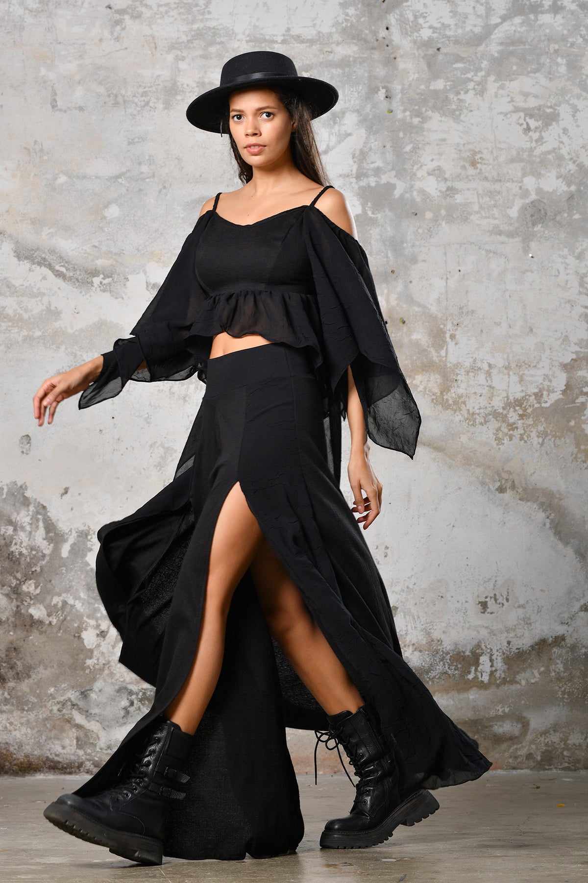 An enchanting Bohemian Venus black blouse, perfect for boho and festival-inspired looks, exuding a goddess-like quality. The flowy fabric and intricate side details create an ethereal, bohemian style perfect for Burning Man and other occasions. This garment is an ethically crafted gem