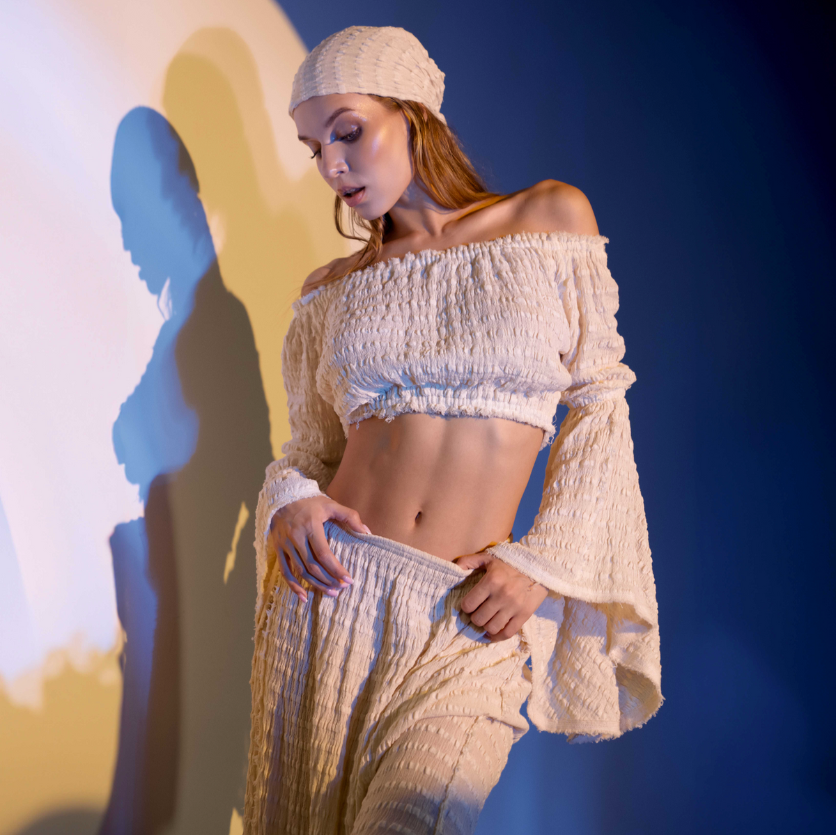 Handwoven cotton off-shoulder blouse in beige, featuring flowy fairy sleeves and an elastic waist for casual bohemian style.