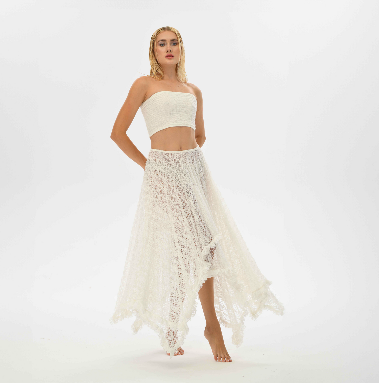 White lace boho skirt, designed for casual and resort wear with a big flowy cut, made from recycled polyester lace.