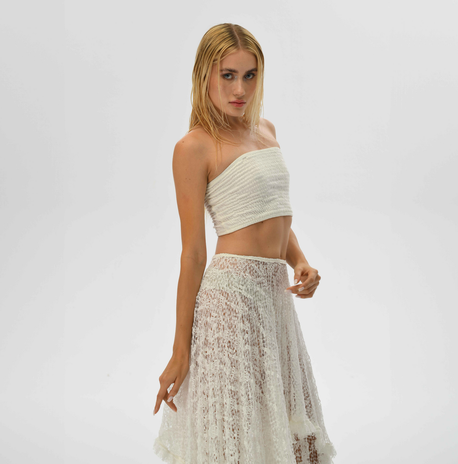 See-through boho lace skirt in white, with a layered design perfect for resort wear or bohemian daily style.