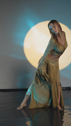 Bohemian desert sand skirt with a unique goddess cut, featuring side splits for ease of movement. This belly dance and tribal fusion-inspired skirt fits sizes XS to L with an elastic waistband.