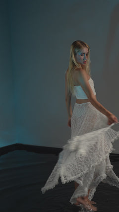 Boho resort skirt in white, made from recycled polyester lace with a see-through design, ideal for beach or casual boho wear.