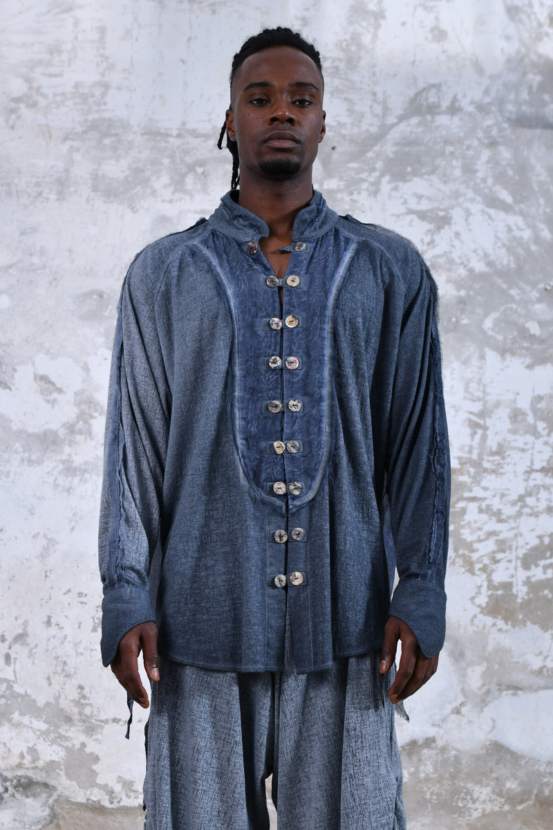 Blue boho men's shirt with alchemy and warrior designs, unique spiritual men's shirt made from soft cotton fabric, conscious clothing for men featuring cruelty-free materials, handcrafted bohemian-style men's shirt with chakra symbols, sustainable men's fashion, men's alchemist warrior shirt with chakra-inspired designs, mindful men's shirt made with eco-friendly materials, comfortable and stylish men's shirt with a spiritual touch, ethical and sustainable men's clothing with unique designs.