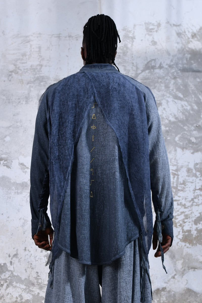 Blue boho men's shirt with alchemy and warrior designs, unique spiritual men's shirt made from soft cotton fabric, conscious clothing for men featuring cruelty-free materials, handcrafted bohemian-style men's shirt with chakra symbols, sustainable men's fashion, men's alchemist warrior shirt with chakra-inspired designs, mindful men's shirt made with eco-friendly materials, comfortable and stylish men's shirt with a spiritual touch, ethical and sustainable men's clothing with unique designs.