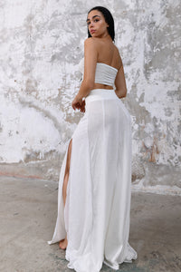 white sexy and dramatic split design, high-quality rayon fabric, comfortable elastic waistband, range of colors, one size fits most, effortlessly chic bohemian style, summer festivals, beach parties, versatile dress up or down style, boho goddess skirt, grecian goddess skirt, bohemian style
